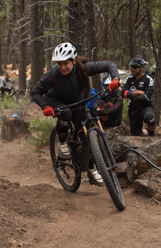 mountain biker cornering during a skills clinic